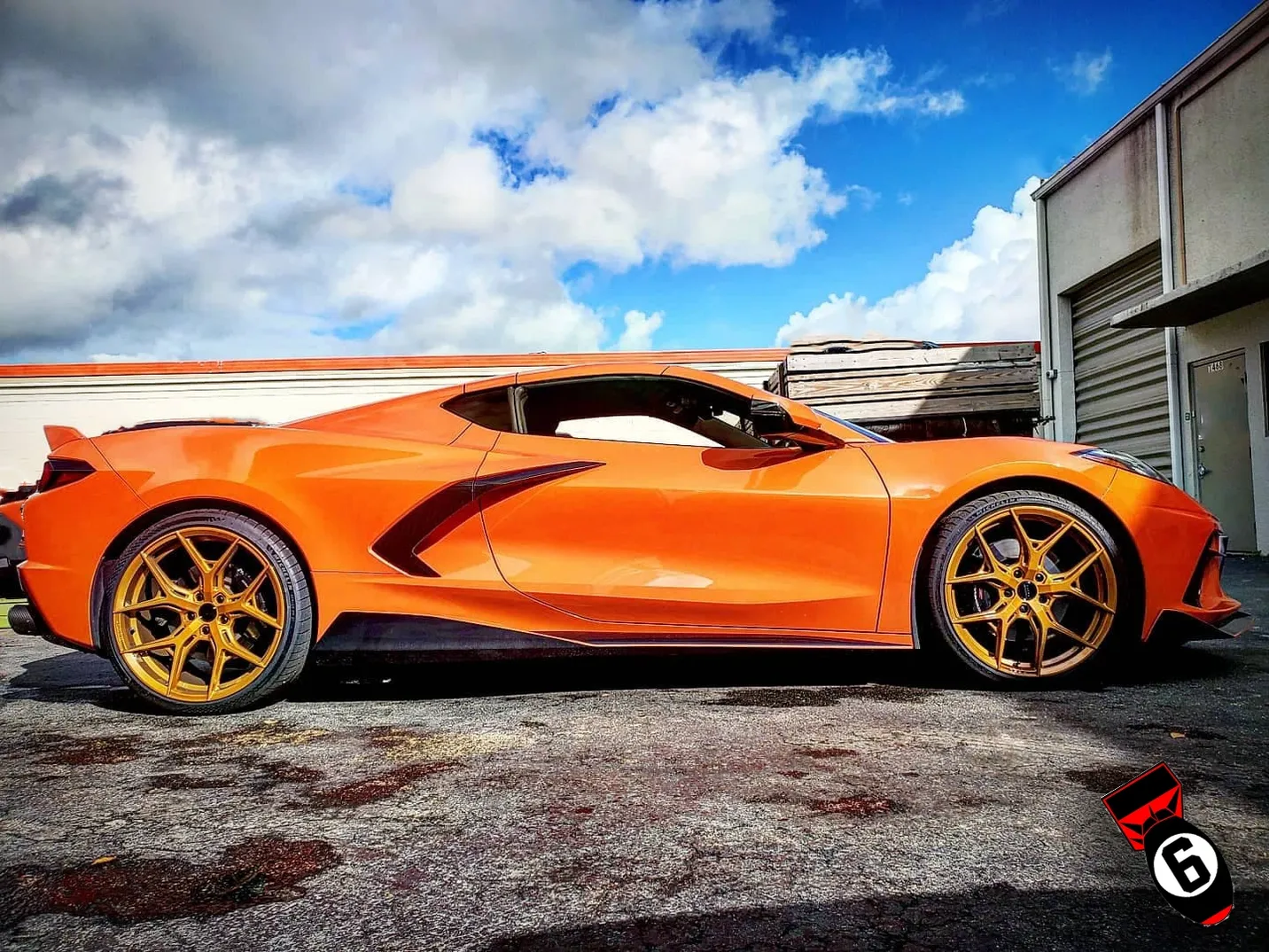 A beautiful sleek custom designed corvette with golden rims