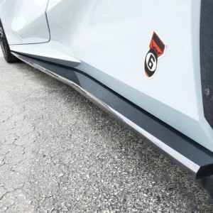 A picture of the lower body of a sports car with a sticker