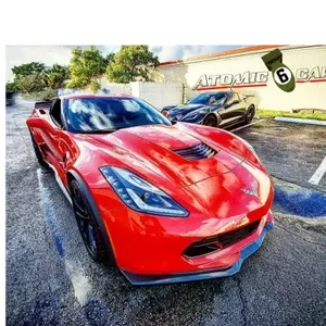 A red color corvette with custom made headlights and rims