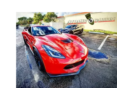 A red color corvette with custom made headlights and rims